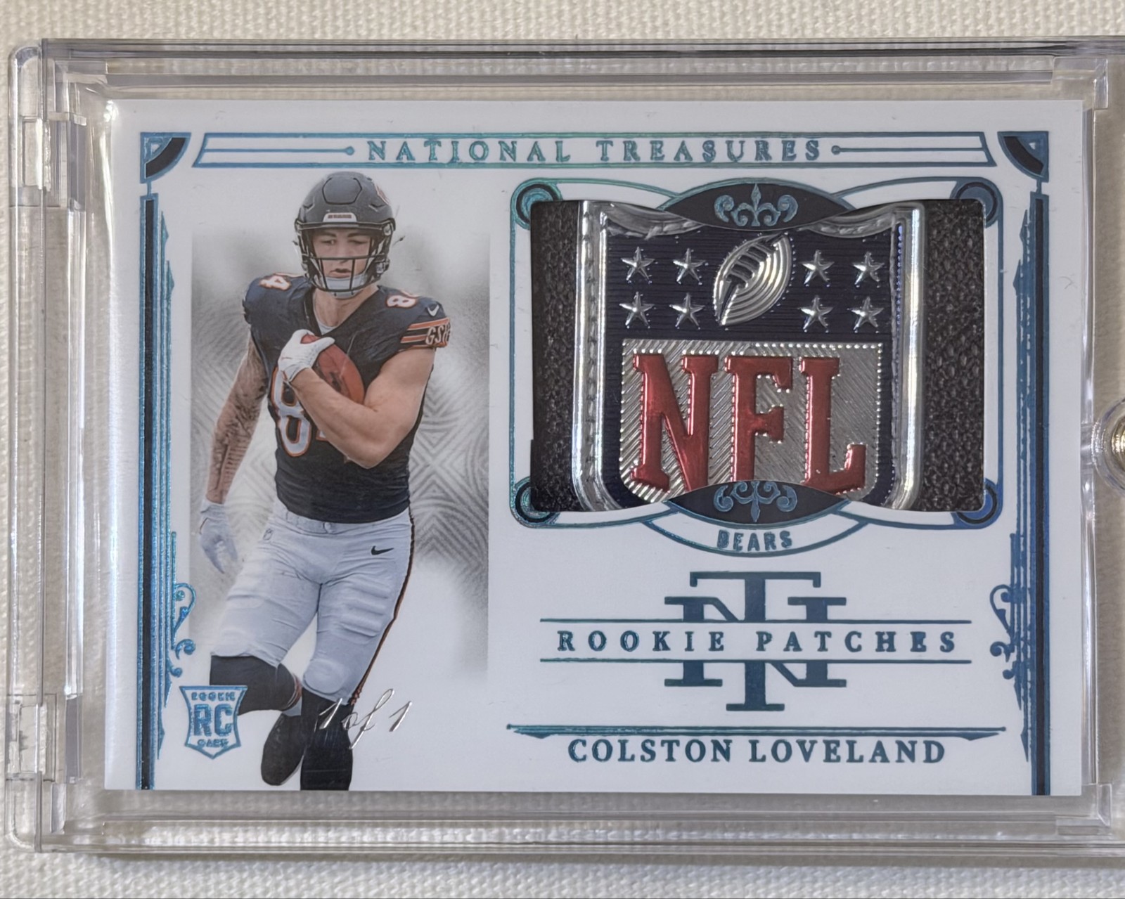 1/1 Colston Loveland National Treasures Rookie NFL Shield Patch – Chicago Bears