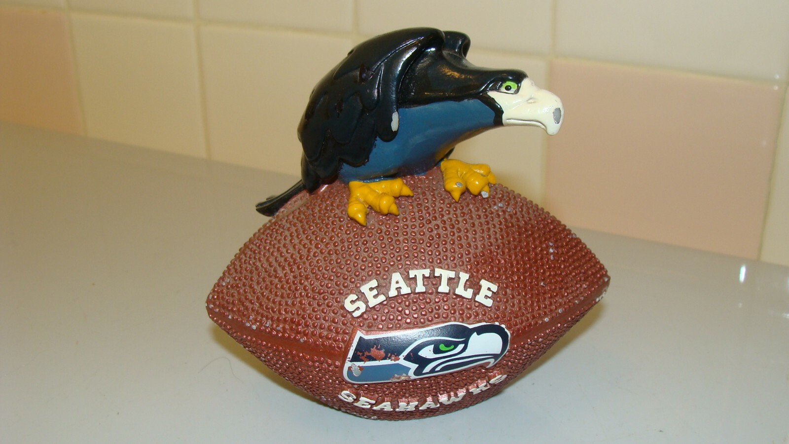 NFL Seattle Seahawks Souvenir Hawk Bird Sitting on Football 4.6″ x 3″ and 4.2″T