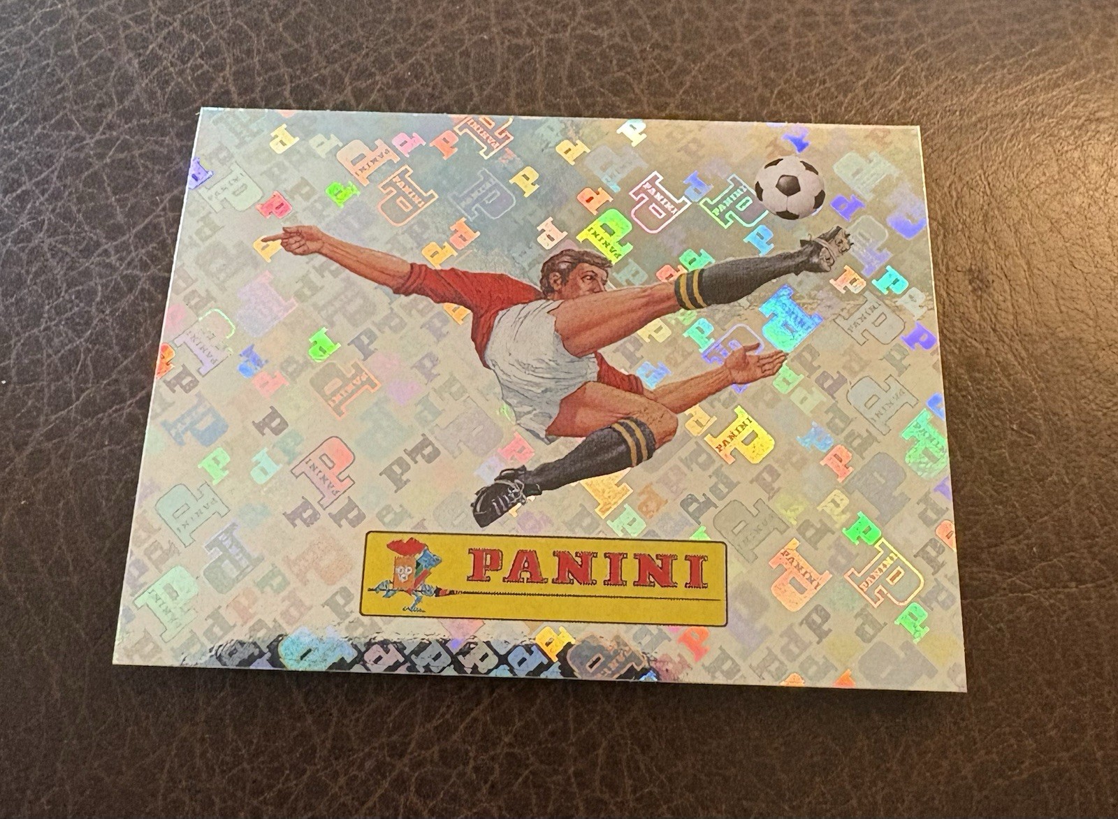 2026 Panini FIFA World Cup Sticker 00 Panini Logo FOIL FWC00