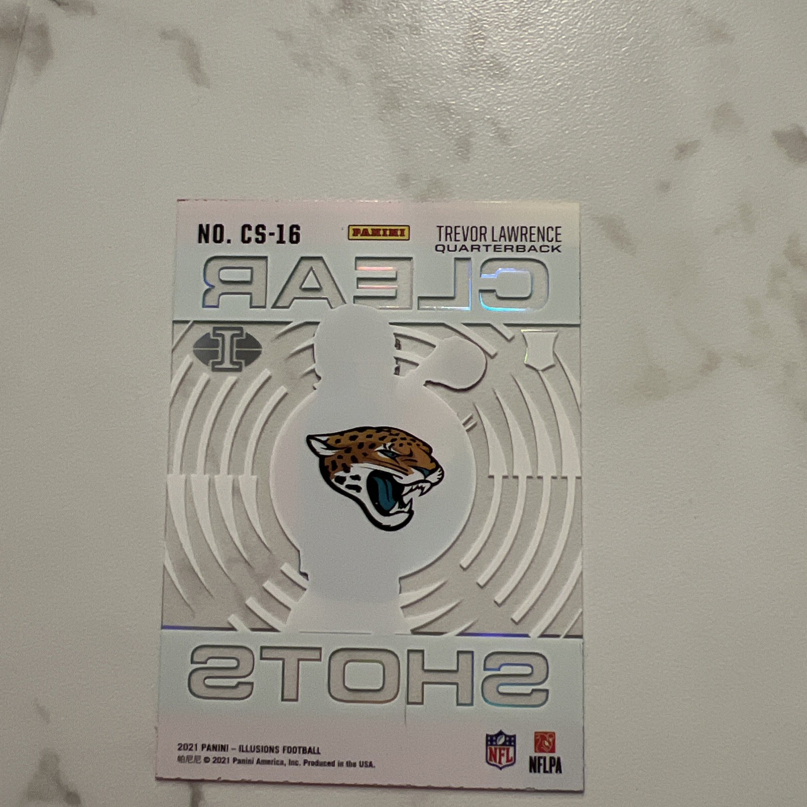 2021 Trevor Lawrence Panini Illusions Clear Shots Light Blue /299 RC