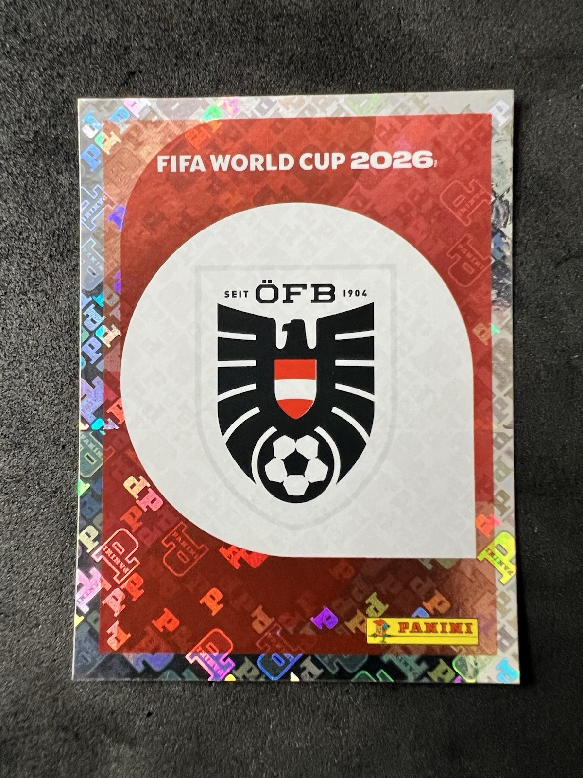 2026 Panini FIFA World Cup Stickers #AUT1 Emblem FOIL