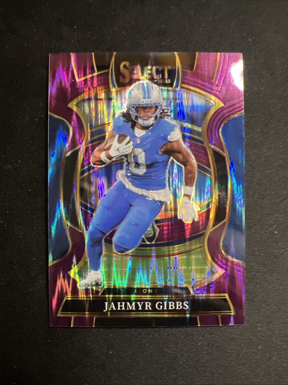 2025 Panini Select Jahmyr Gibbs Concourse Purple Shock /699 No. 71 Lions