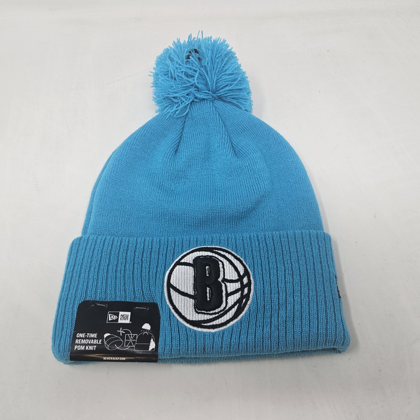 Unisex Adult New Era Brooklyn Nets x KAWS City Edition Blue Pom Knit Beanie