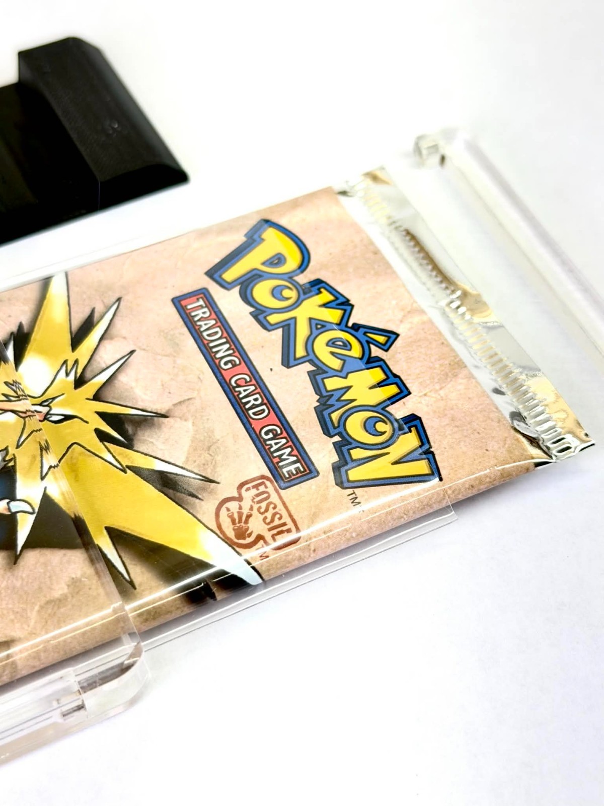 Premium Pokémon Booster Pack Acrylic Display Case with Sleeve & Black Stand