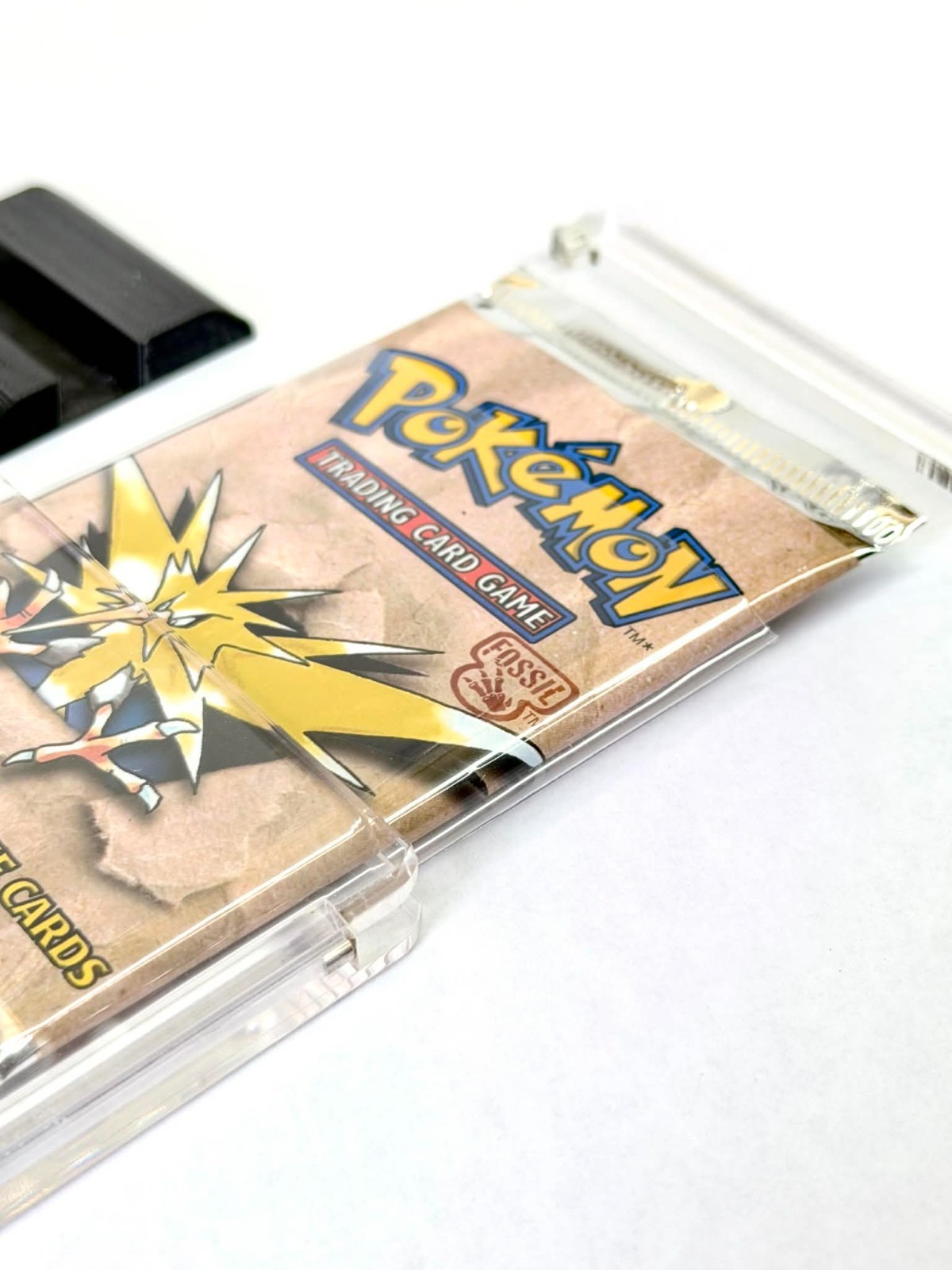 Premium Pokémon Booster Pack Acrylic Display Case with Sleeve & Black Stand