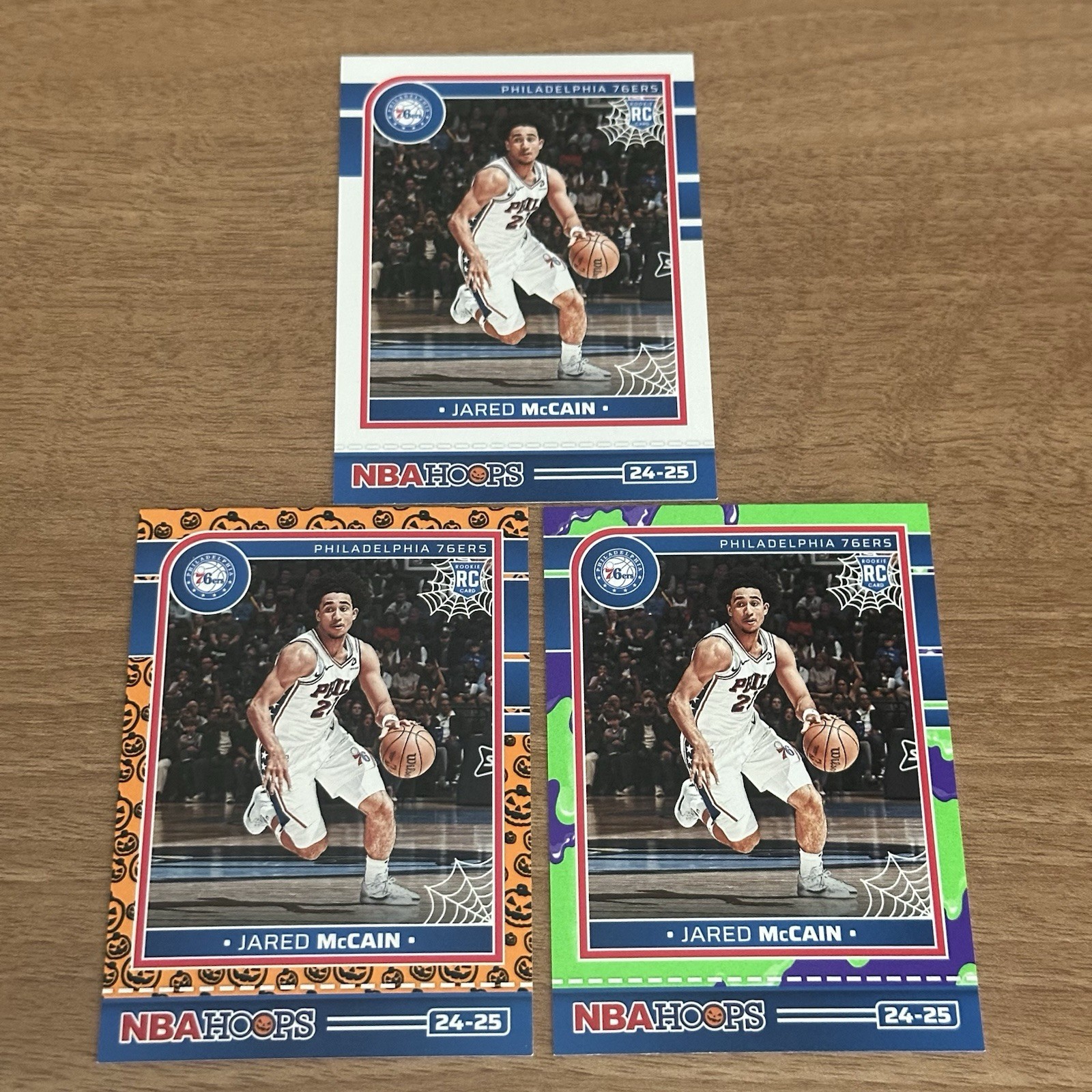 2024-25 Panini Haunted Hoops Jared McCain #263 Orange Pumpkin Slime Rookie 76ers