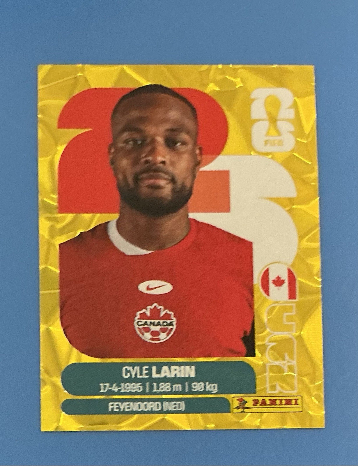 Cyle Larin Panini FIFA World Cup 2026 Gold Crumple Parallels Sticker