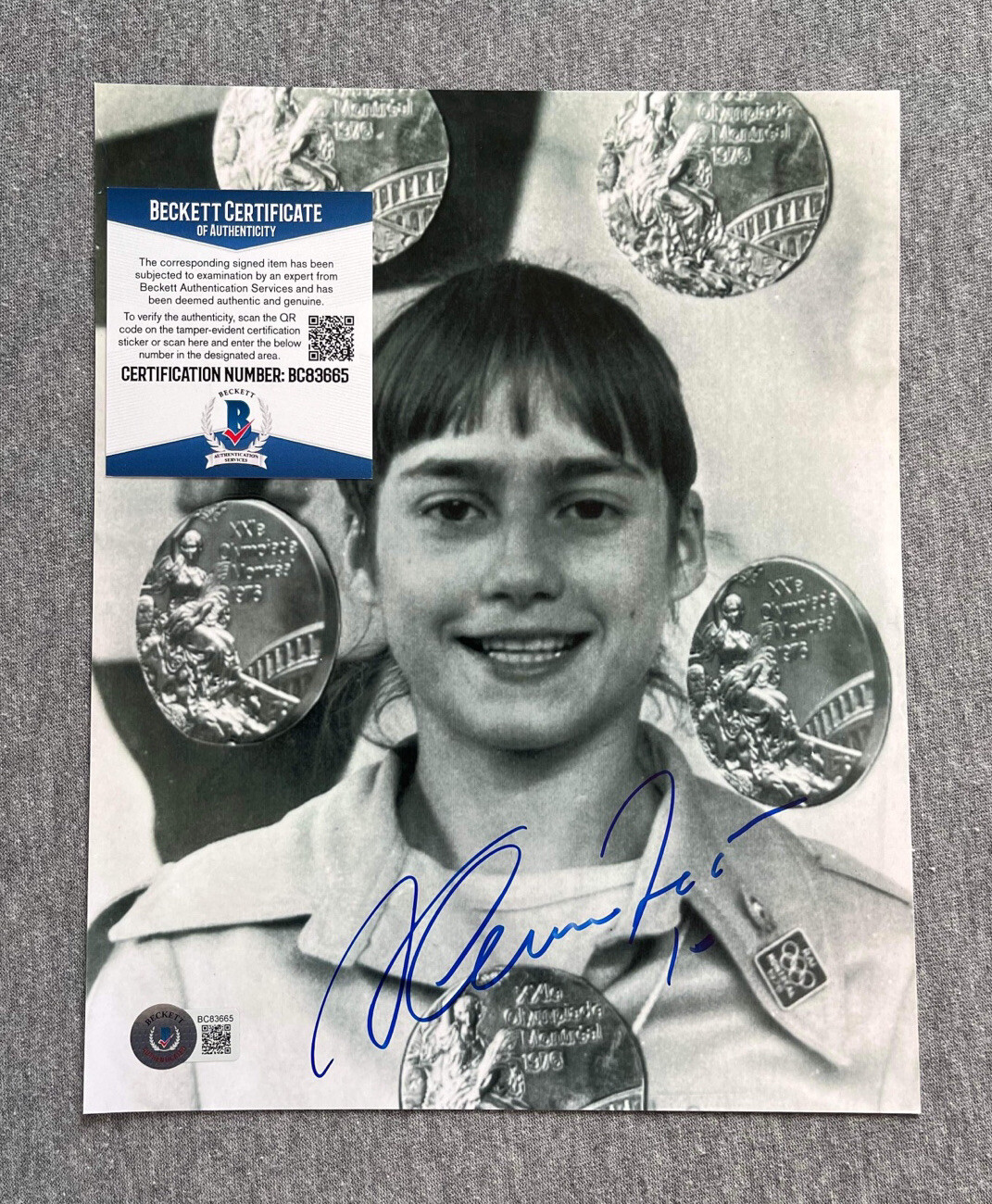 OLYMPIC GYMNAST- NADIA COMANECI SIGNED 8×10 PORTRAIT MEDAL PHOTO BECKETT BC83665