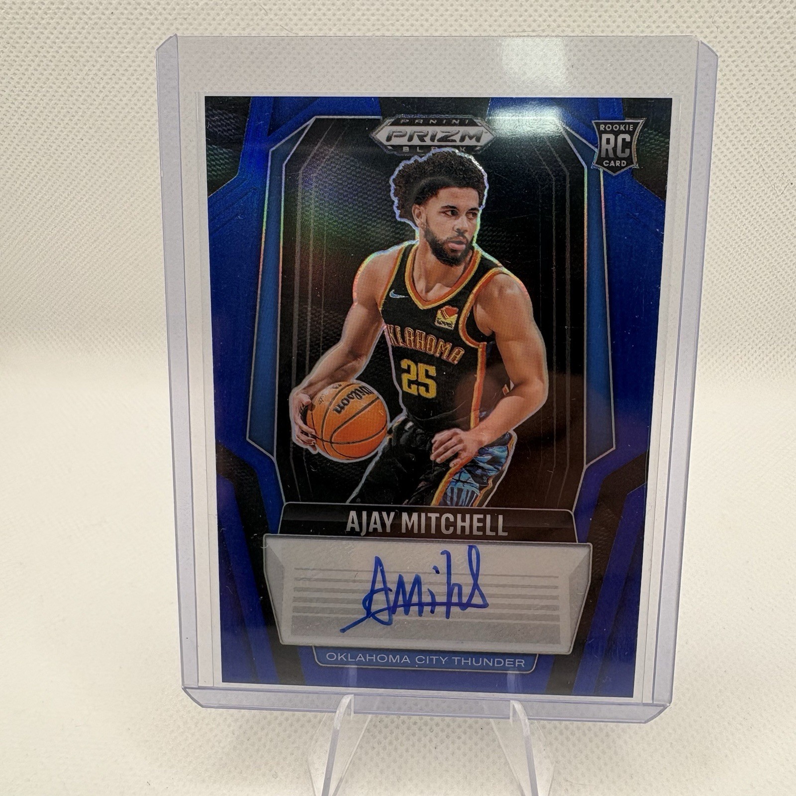 2024-25 Panini Prizm Black Ajay Mitchell Blue Prizm Auto /49 (RC) #RS-MIT