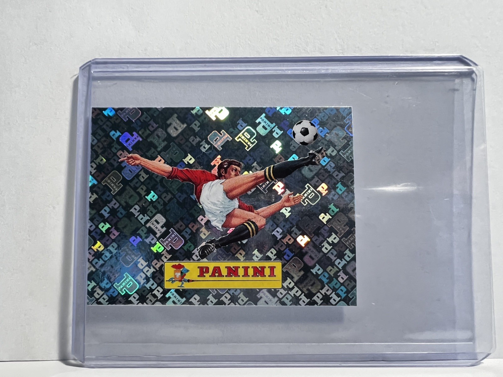2026 Panini FIFA World Cup Sticker 00 Panini Logo FOIL FWC00