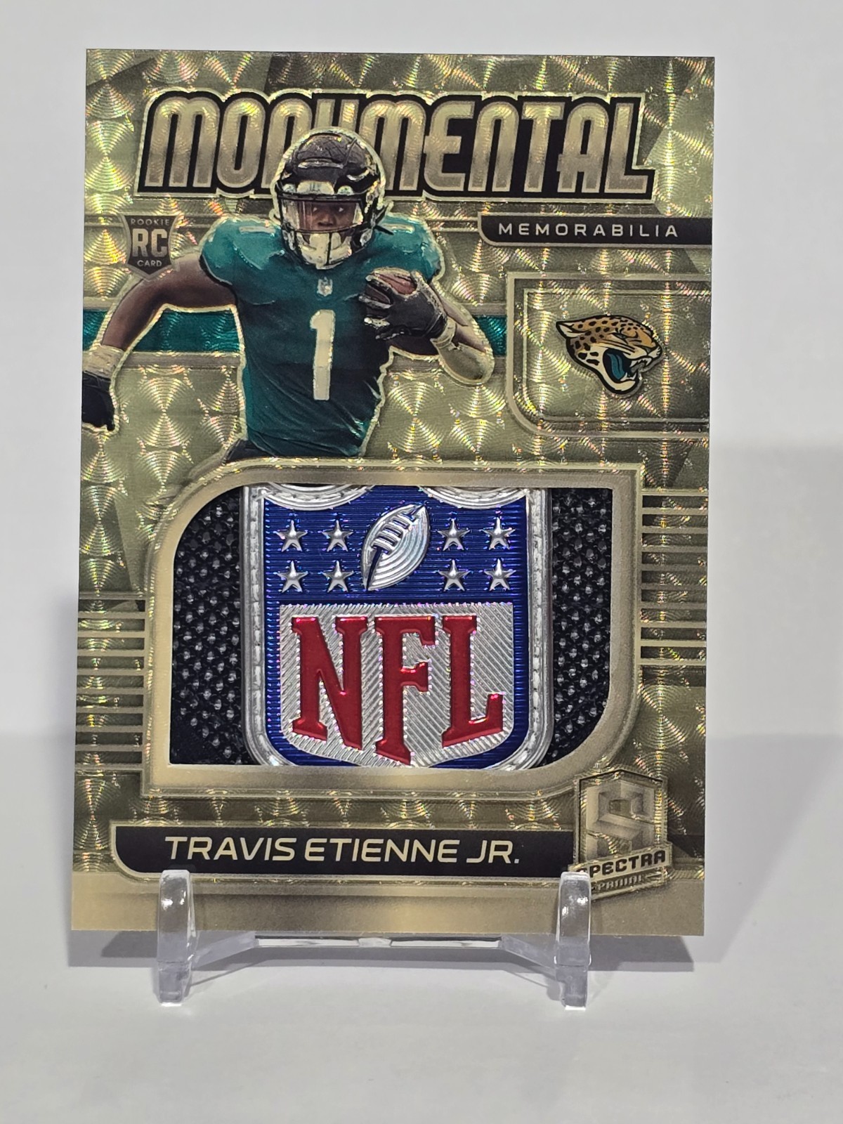 2021 Spectra Travis Etienne Jr Gold Vinyl “NFL Shield” 1/1