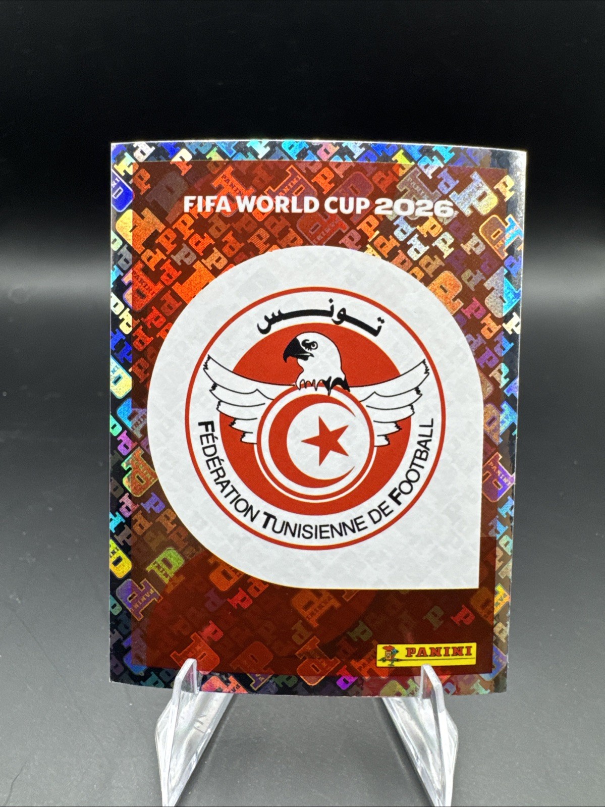 2026 Panini FIFA World Cup Sticker Collection #TUN1 Team Logo Tunisia Foil