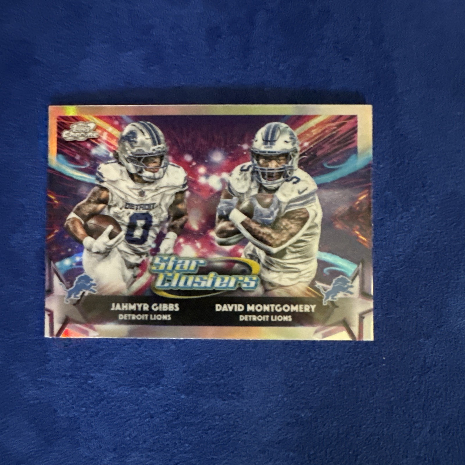 2025 Topps Chrome Cosmic Football Star Clusters Jahmyr Gibbs/David Montgomery
