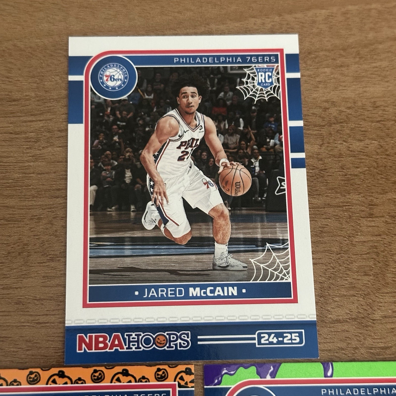 2024-25 Panini Haunted Hoops Jared McCain #263 Orange Pumpkin Slime Rookie 76ers