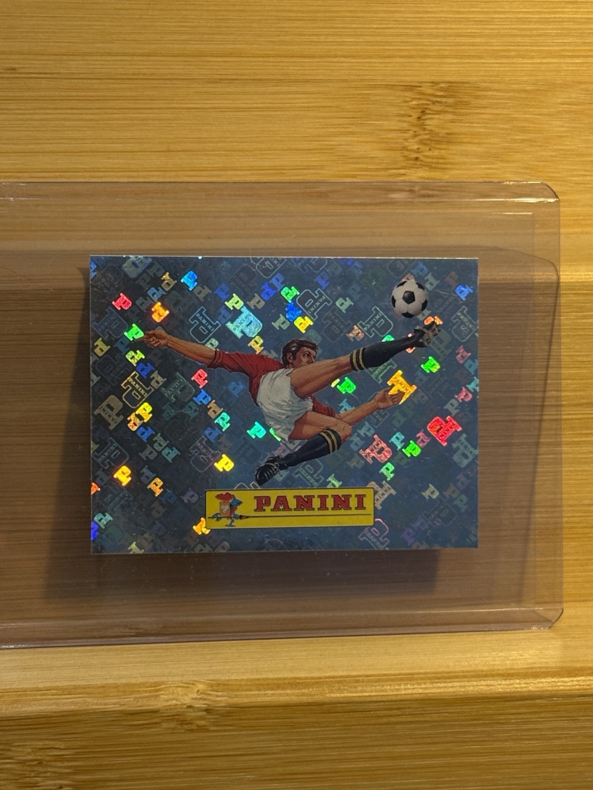 2026 Panini FIFA World Cup Panini Logo Refractor Mini Sticker Short Print 00