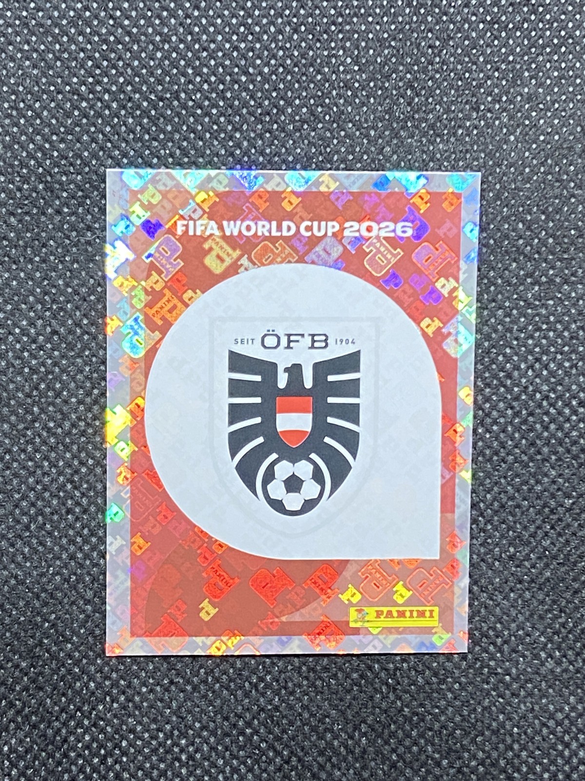 2026 Panini FIFA World Cup Stickers Emblem FOIL AUT Austria #AUT1