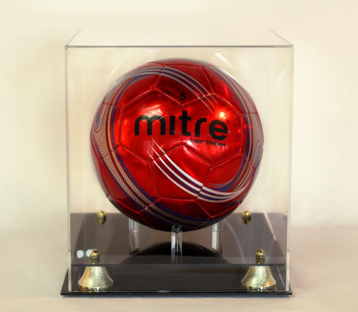 Soccer ball display case acrylic with two-tier black base. Gold corner risers