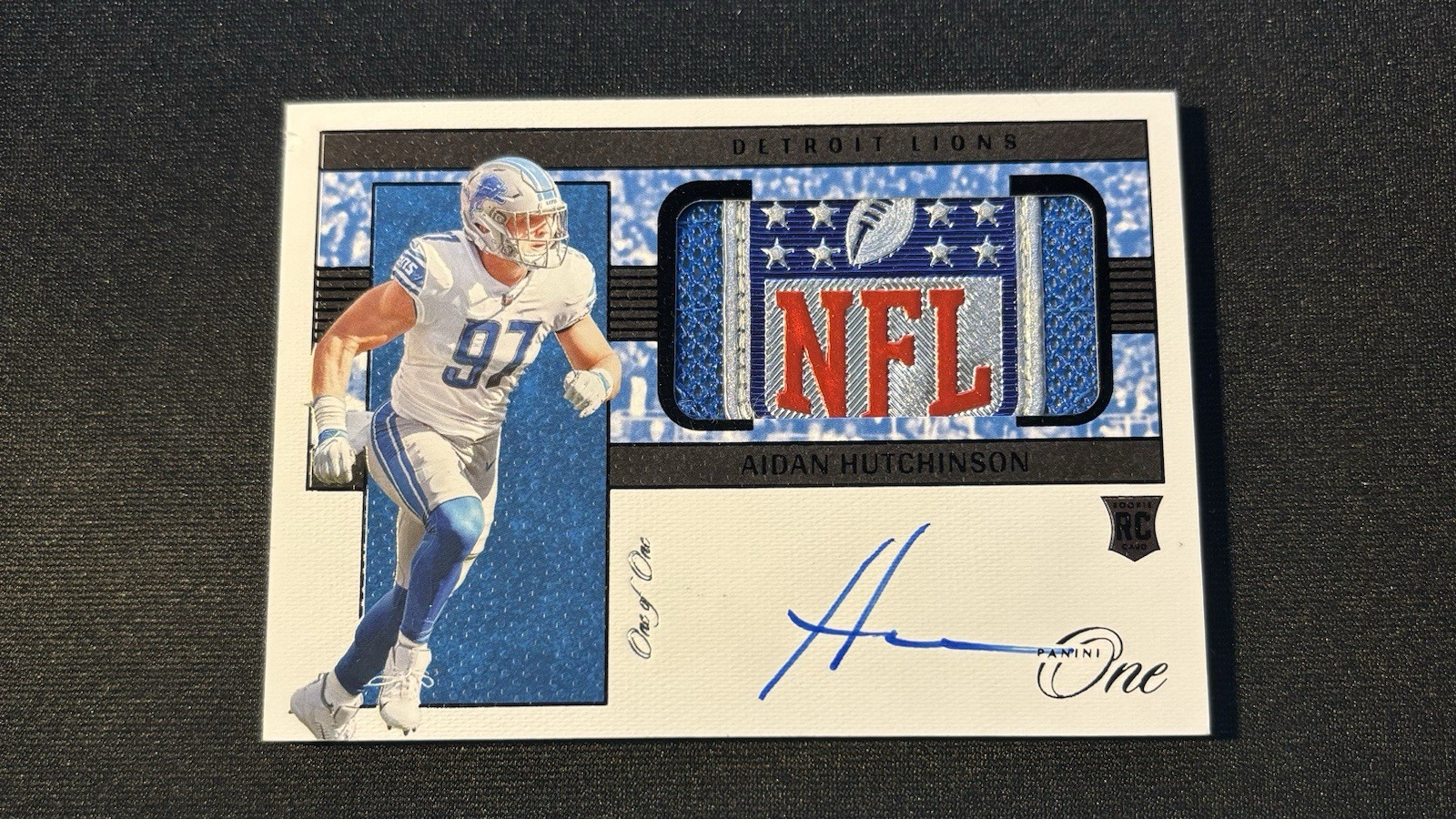 2022 Aidan Hutchinson Panini One 1/1 Shield Patch Auto #1/1 NFL Shield #2